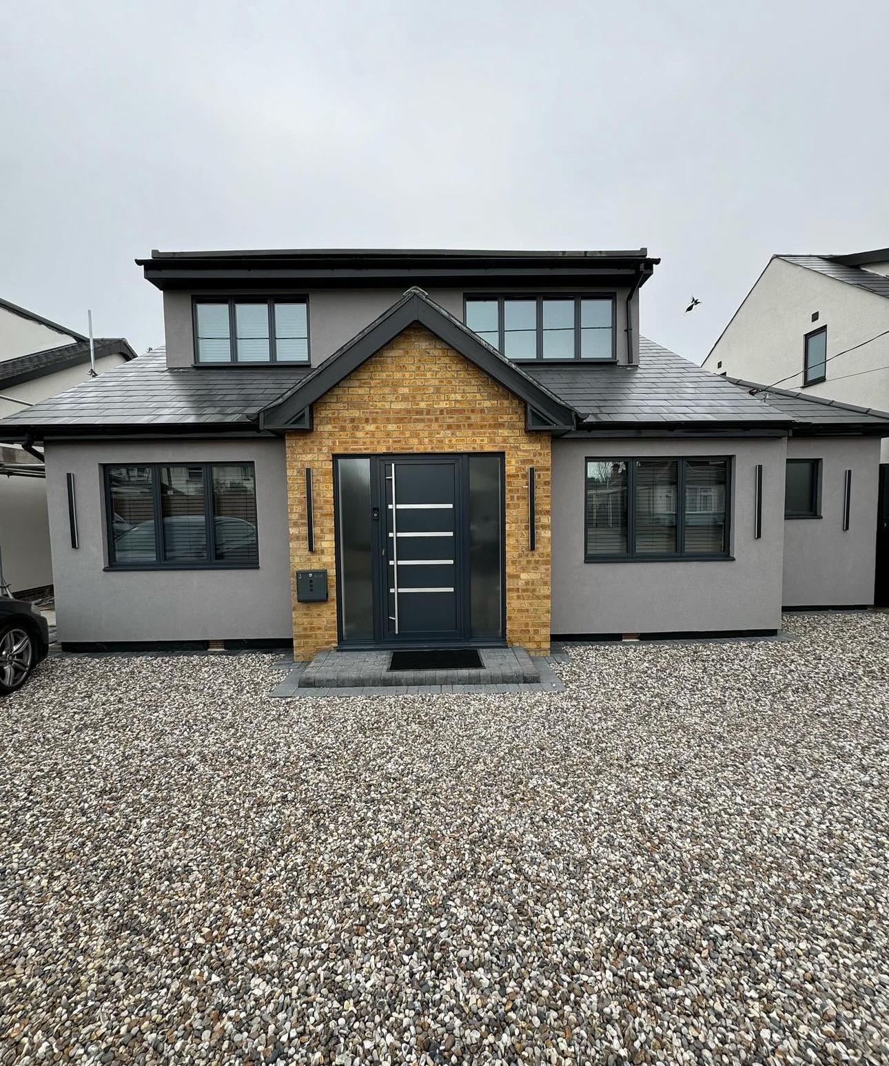 Bronze-effect UPVC bay windows and porch